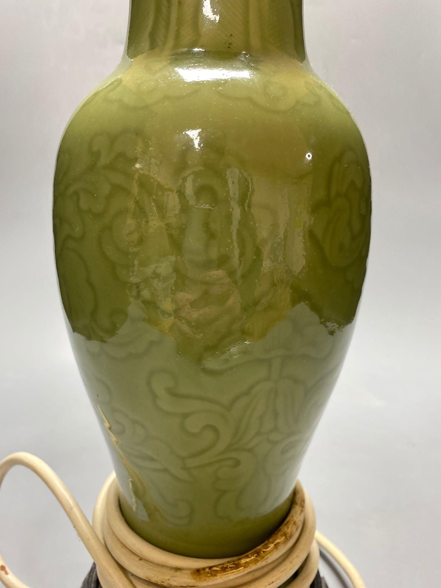 A Chinese green celadon baluster vase, adapted as a table lamp, total height excluding the top fitting 32cm